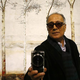 Abbas Kiarostami snaps a photo at a museum retrospective earlier this year. (Photo: Anadolu Agency / Getty Images)